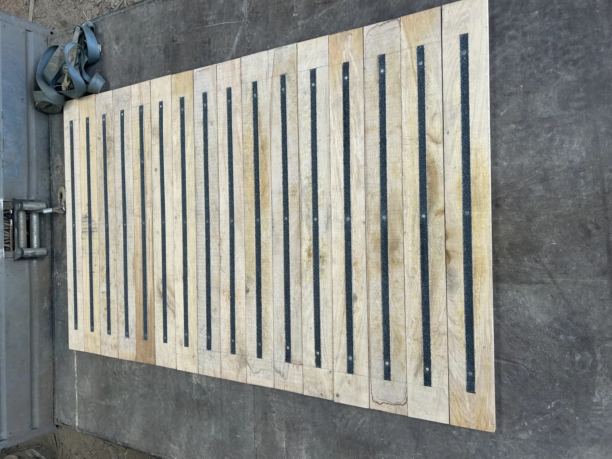 Non-slip decking boards laid out, showing the anti-slip strips